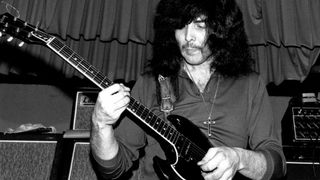 Black Sabbath guitarist Tony Iommi performs with a Gibson SG Special and Laney amp