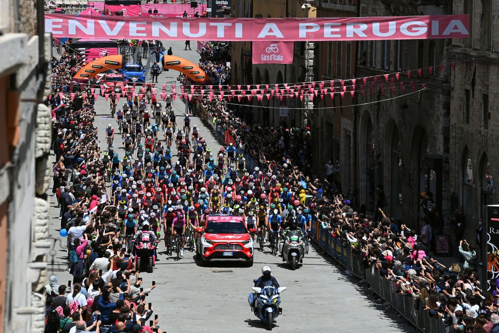 MONTALCINO ITALY MAY 19 The peloton passing through Perugia Village at start during the 104th Giro dItalia 2021 Stage 12 a 162km stage from Perugia to Montalcino 554m Public Fans Landscape girodiitalia UCIworldtour Giro on May 19 2021 in Montalcino Italy Photo by Stuart FranklinGetty Images