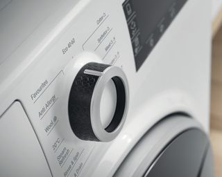 A close-up of a washing machine control dial