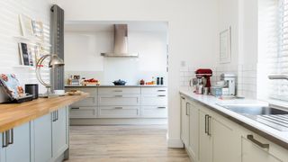 gray and white kitchen with cooker hood over oven to show how to improve air quality in your home