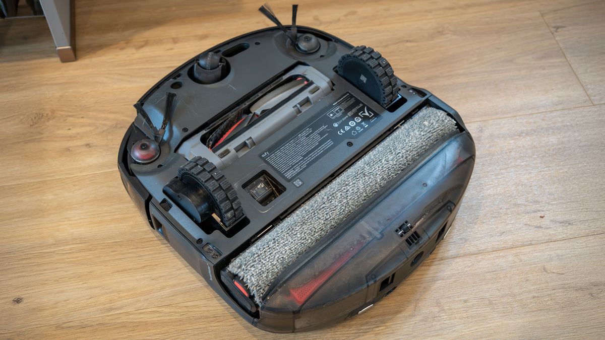 Eufy Omni S2 robot vacuum upside down, showing mop roller