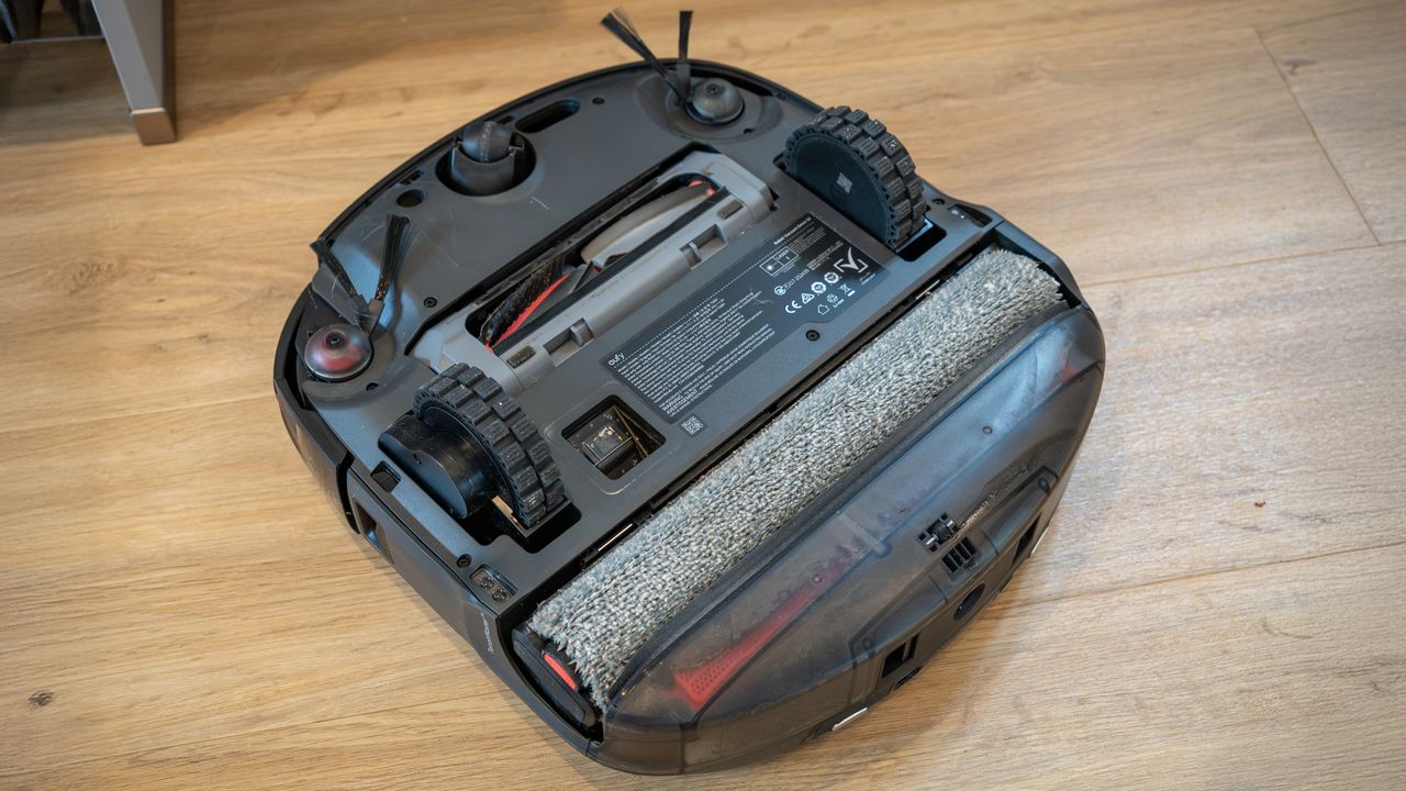 Eufy Omni S2 robot vacuum upside down, showing mop roller