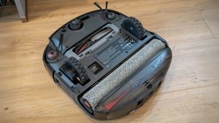 Eufy Omni S2 robot vacuum upside down, showing mop roller