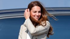 Kate Middleton wears a cream blazer as she arrives to meet those who supported the UK's evacuation of civilians from Afghanistan at RAF Brize Norton on September 15, 2021 in Brize Norton, England. 