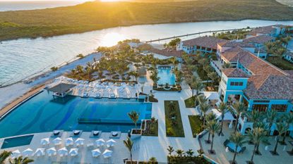 Arial view over Sandals Royal Curaçao showing the main building, infinity pool and quiet pool