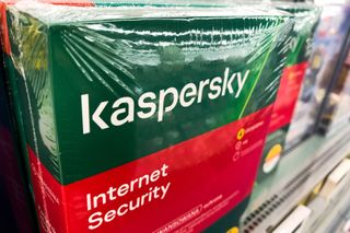 A product box of Kaspersky Internet Security on a store shelf.