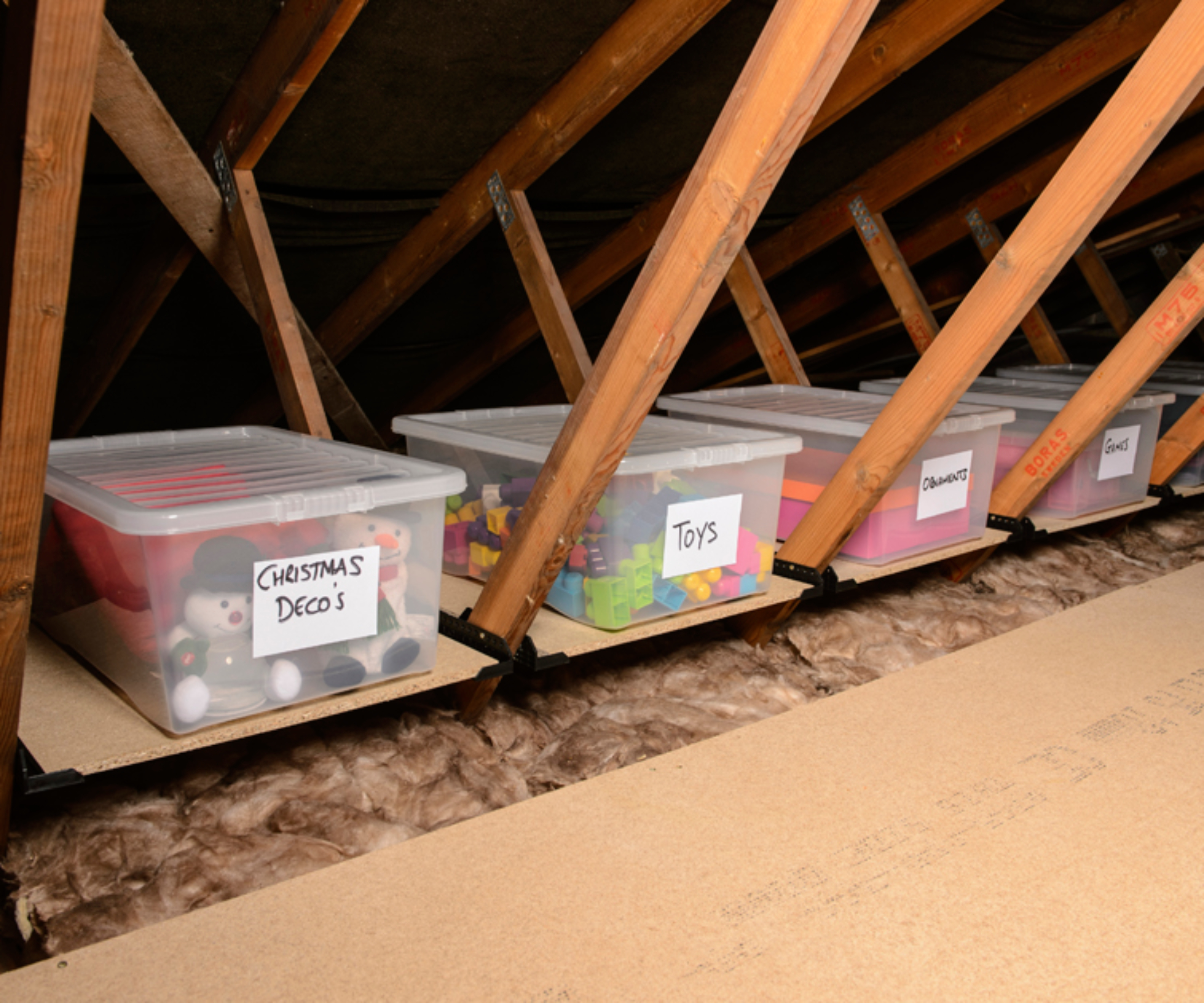 loft storage with clear boxes labelled