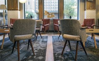 A close-up of the chairs inside the hotel. The chairs are a mixture of grey or brown colour.
