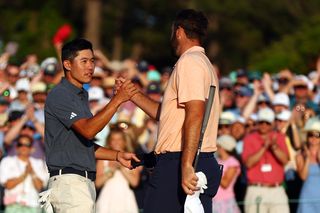 Collin Morikawa and Scottie Scheffler shake hands on the 18th green at Augusta National