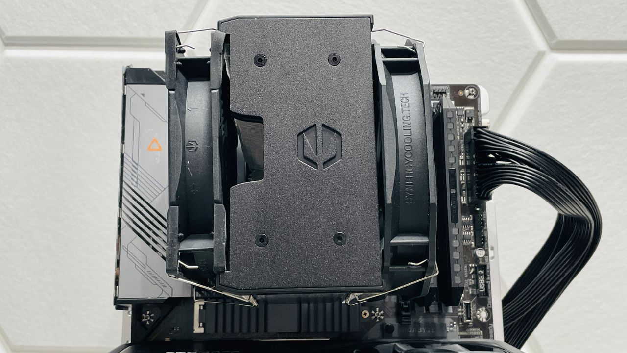 Endorfy Fortis 5 air cooler on a desk and loaded onto a motherboard.