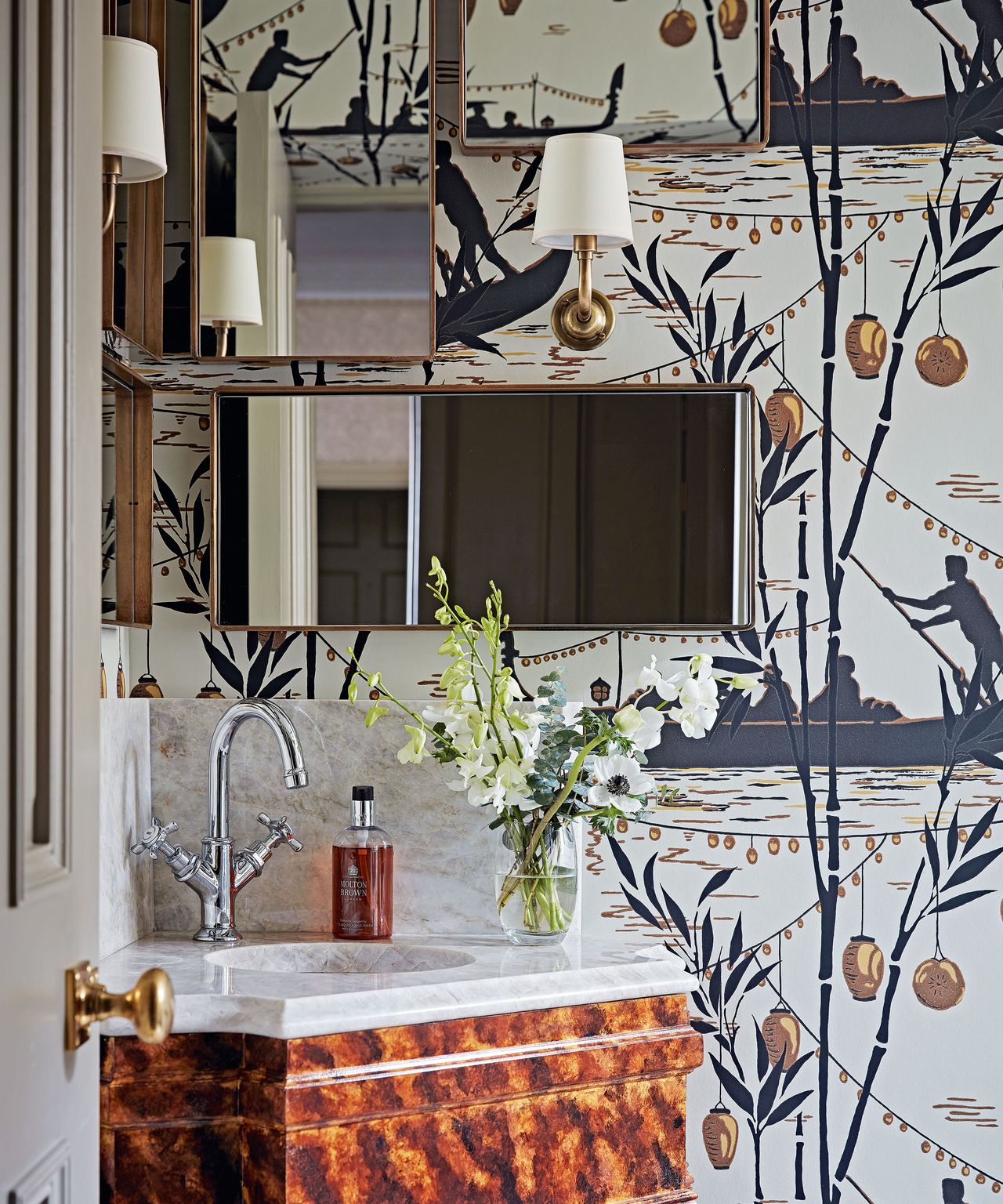 Bathroom unit surrounded by stylized wallpaper
