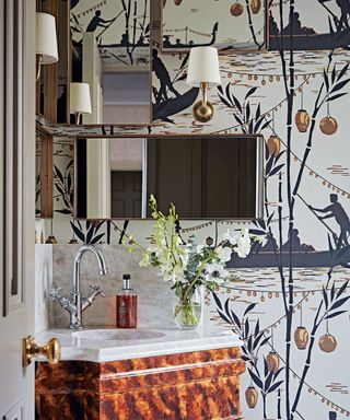 Bathroom unit surrounded by flowery wallpaper