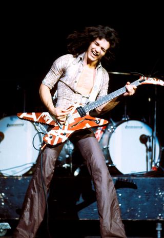 Eddie Van Halen performing live onstage, playing Ibanez Destroyer