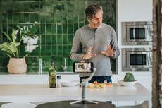 Male Chef preparing Food and Speaking on Camera for Vlog.