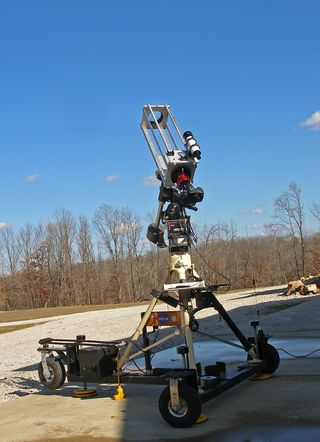 Waiting for "first light" with a home-built 108mm refractor on a home-built astronomy cart. The cart has a built-in 12-Volt source, a scanner radio for NOAA weather, leveling jacks and a custom shelf for a DVD burner I use when making videos of the sky.