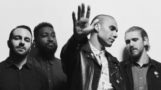Letlive. and Jason Aalon Butler (second right)