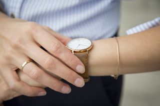 Woman checking the time on her watch