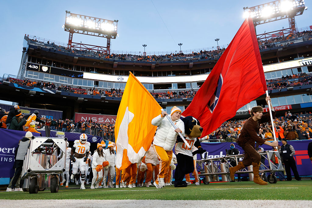 University of Tennessee football players running onto the field