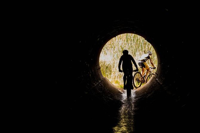 Christoph Sauser and Jaroslav Kulhavy of Burry Stander-Songo ride through a pipe