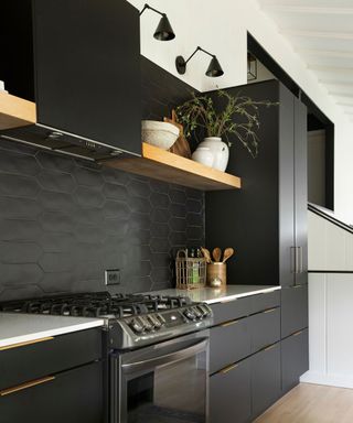 black mid century modern kitchen cabinets by davis interiors