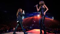 Singer-songwriters Alanis Morissette (L) and Taylor Swift perform onstage during Taylor Swift The 1989 World Tour Live In Los Angeles at Staples Center on August 24, 2015 in Los Angeles, California. 