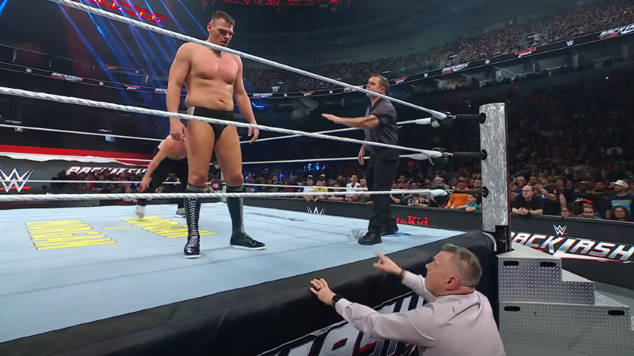 Gunther and Michael Cole at Backlash