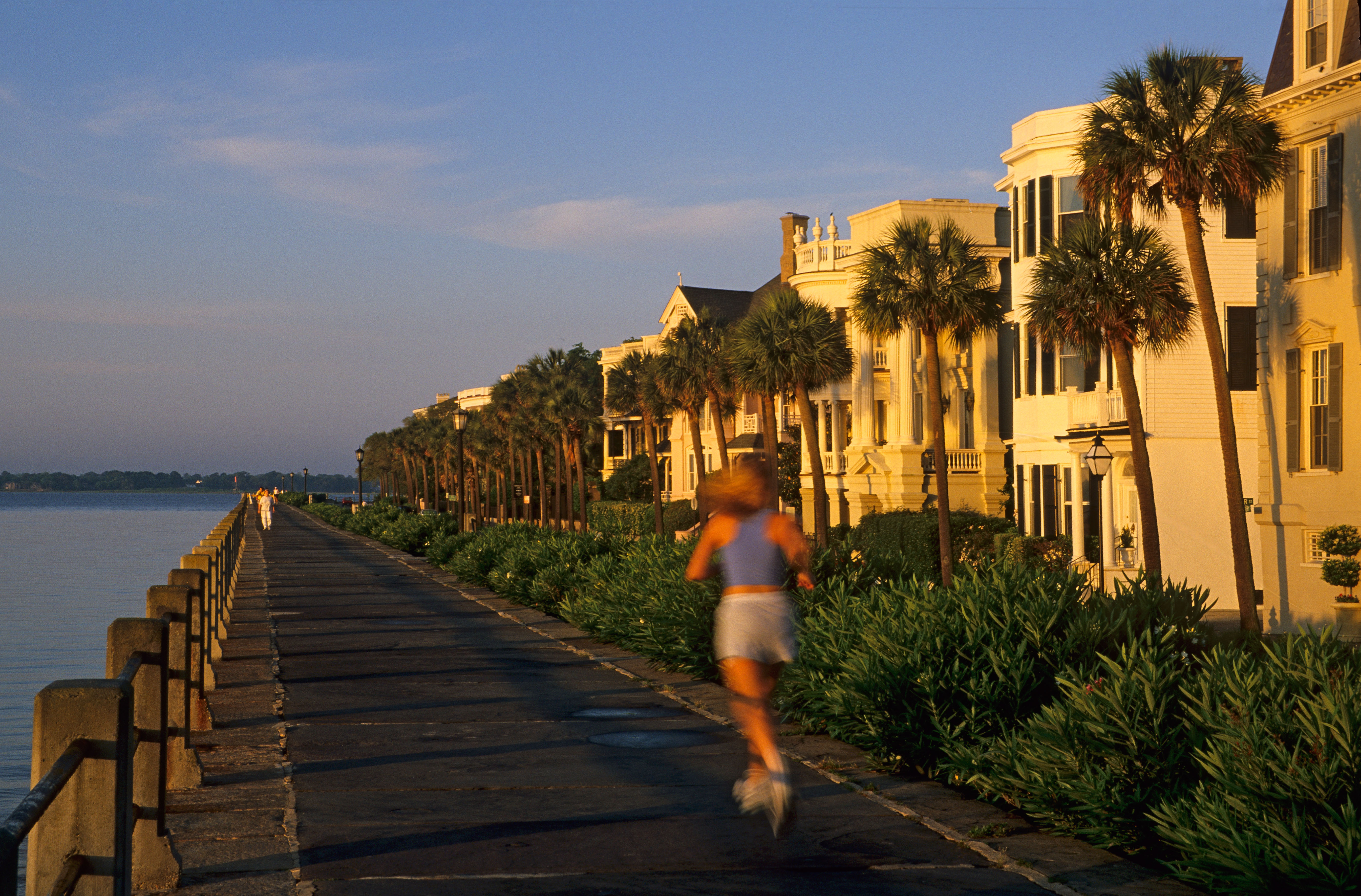 A lady jogs along the Battery in Charleston south Carolina