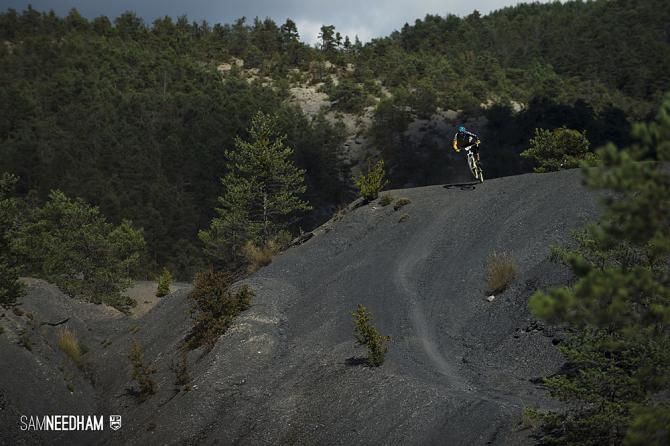 A rider takes on a gravelly section