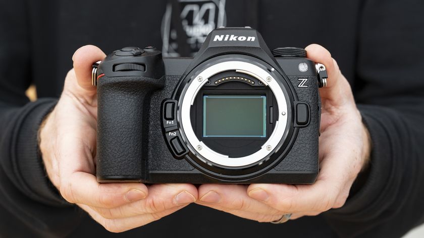 Nikon Z6 III camera in the hand with no lens attached and full-frame sensor on display