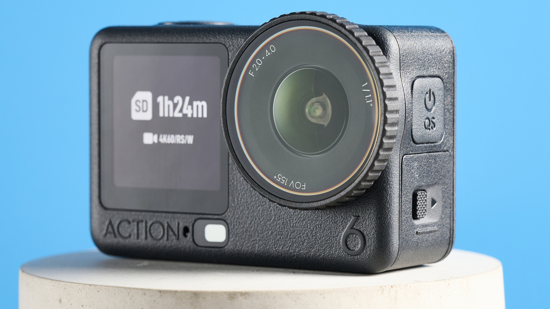 The DJI Osmo Action 6 on a stone surface with a blue background