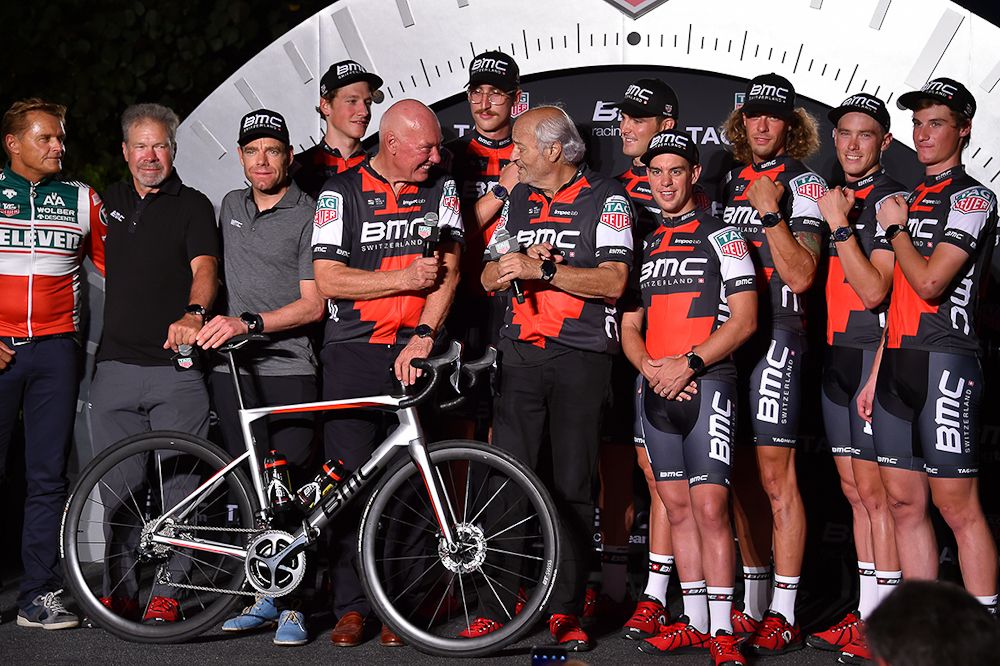 Jean-Claude Biver, (c) TAG Heuer CEO, and Andy Rihs, owner of BMC Racing, greet riders after announcing their new partnership