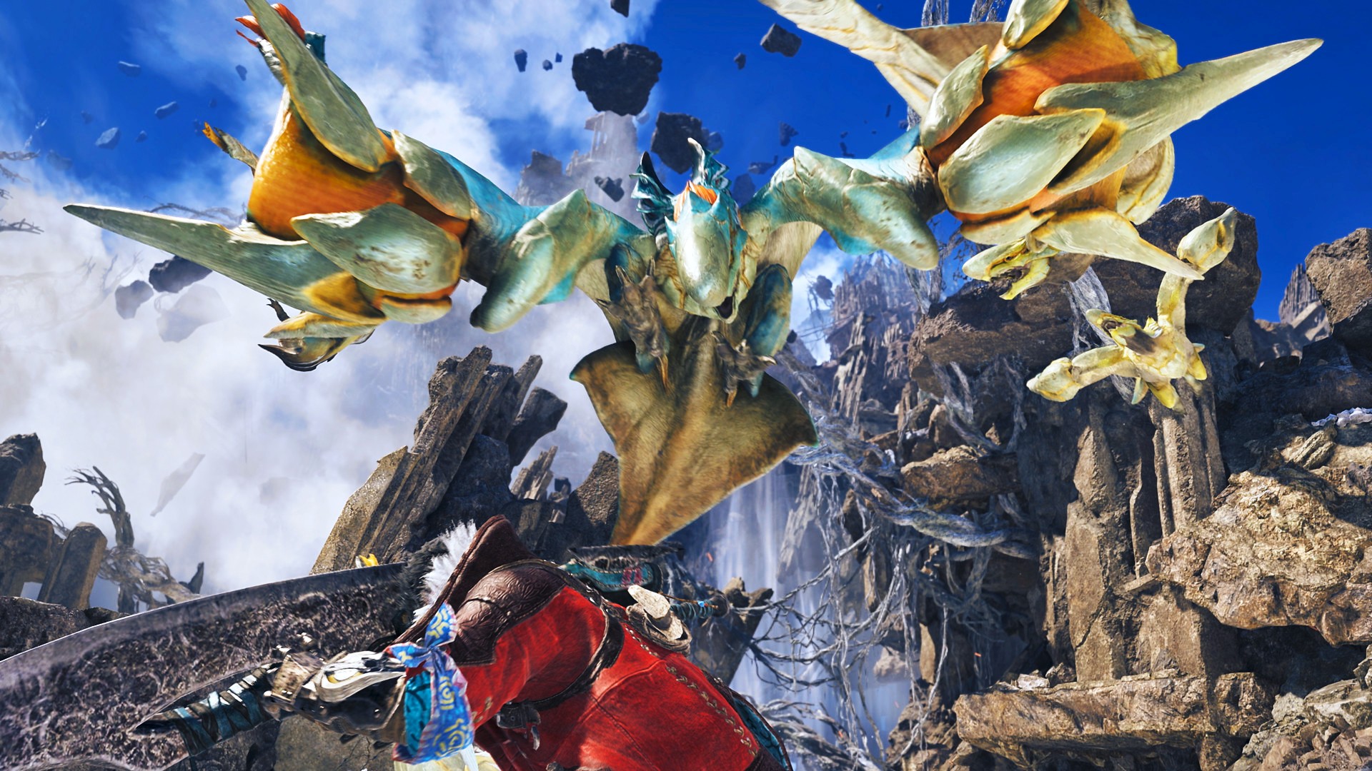 Flying monsters with a green bodies swoop down on a monster hunter wearing a red jacket, set against rocky mountains on a clear day with blue skies.