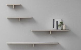 'Egala' shelf collection by Retegui. Different sized white wall shelves.