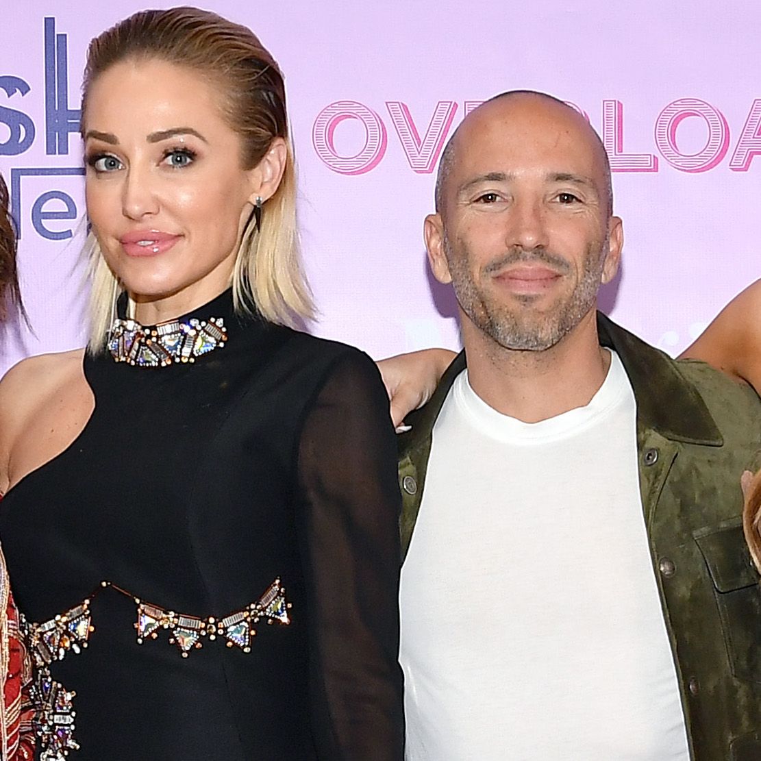 jason oppenheim and mary fitzgerald from selling sunset pose together