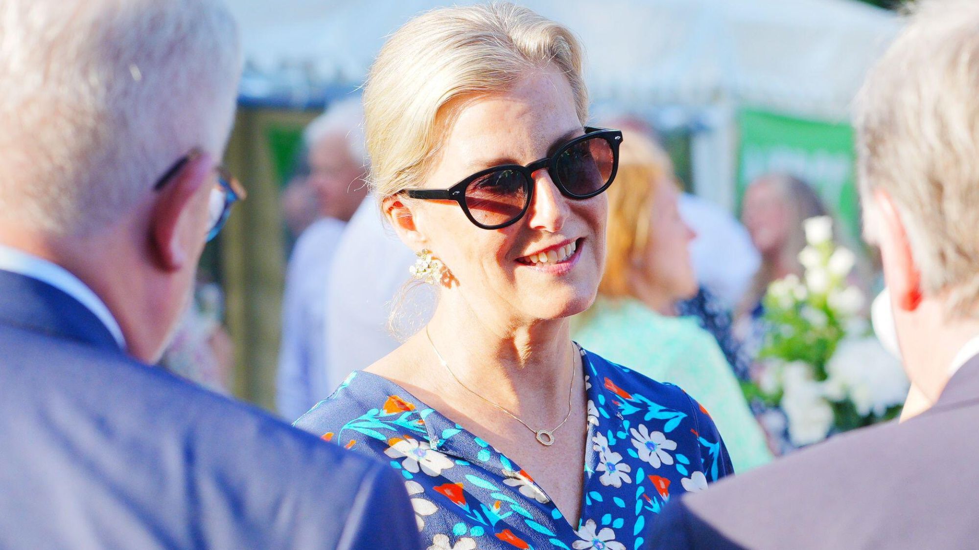 The Duchess of Edinburgh speaks to guests during a NSPCC reception in Jersey, wearing sunglasses