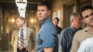 Austin Stowell's Gibbs standing next to long line at the NIS office in NCIS: Origins