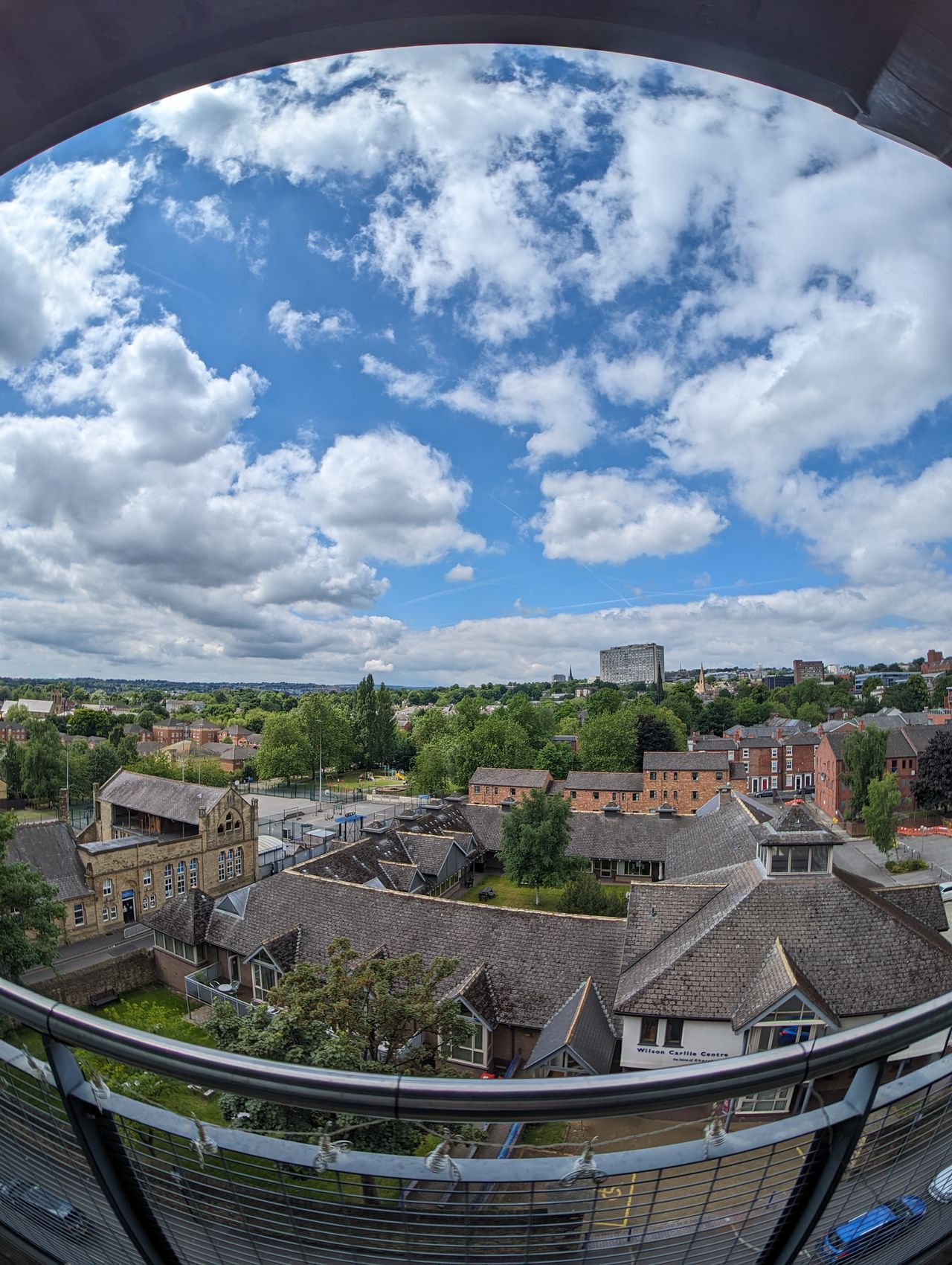 A photo of a city taken with a Moment Fisheye 14mm lens attached to a Google Pixel 7 Pro