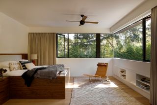 Light filled master bedroom with wrap around windows