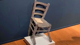 Destroyed chair in an art gallery