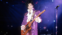 Prince performs onstage during the 1984 Purple Rain Tour on November 4, 1984