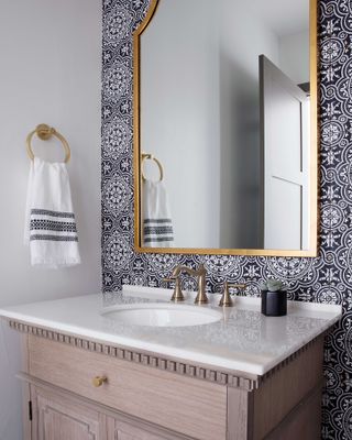Powder room with wallpaper