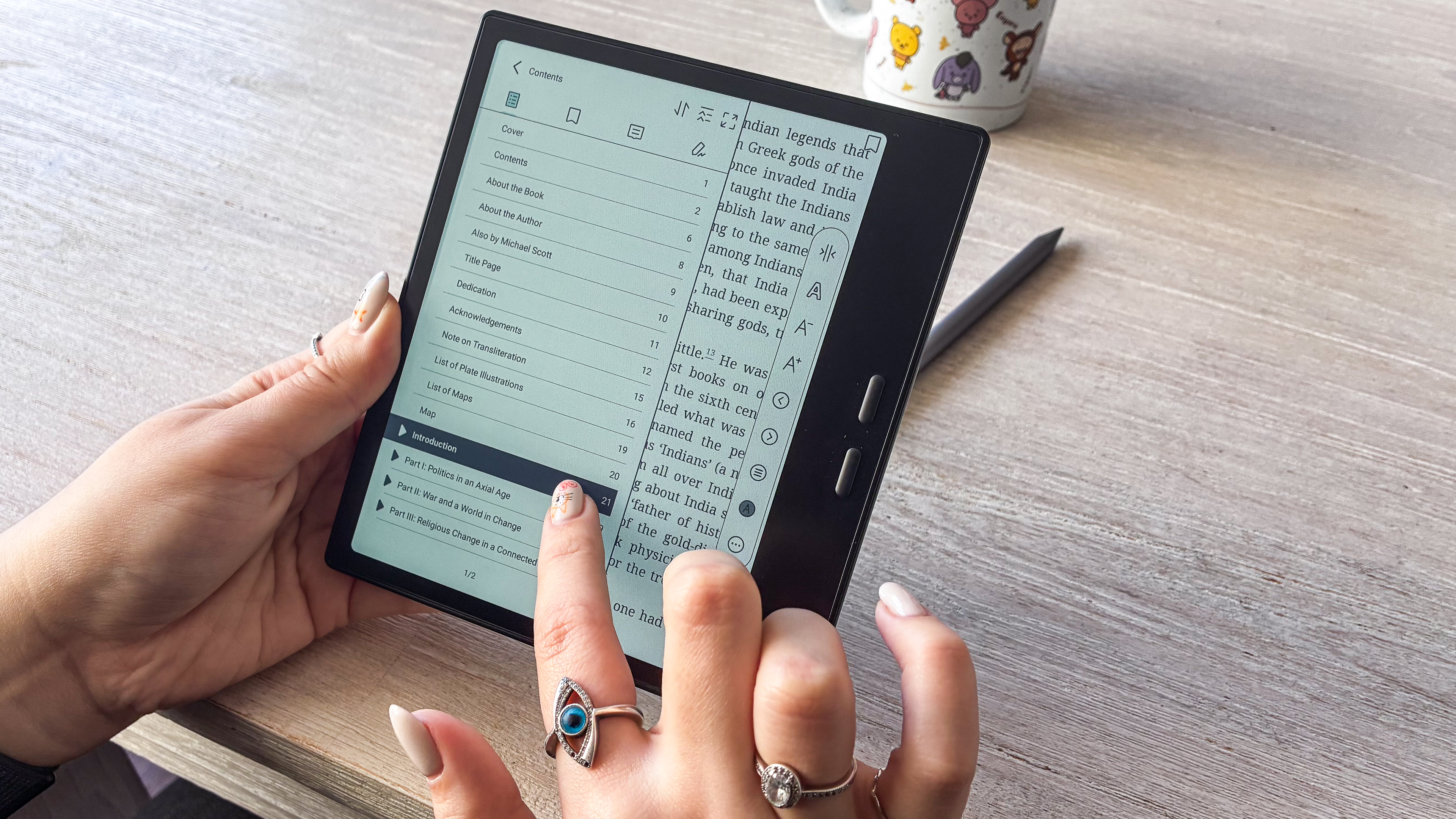 A person using the touchscreen of the Boox Go Color 7 Gen II ereader