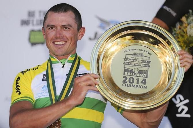 Simon Gerrans with his gold pan prize for winning