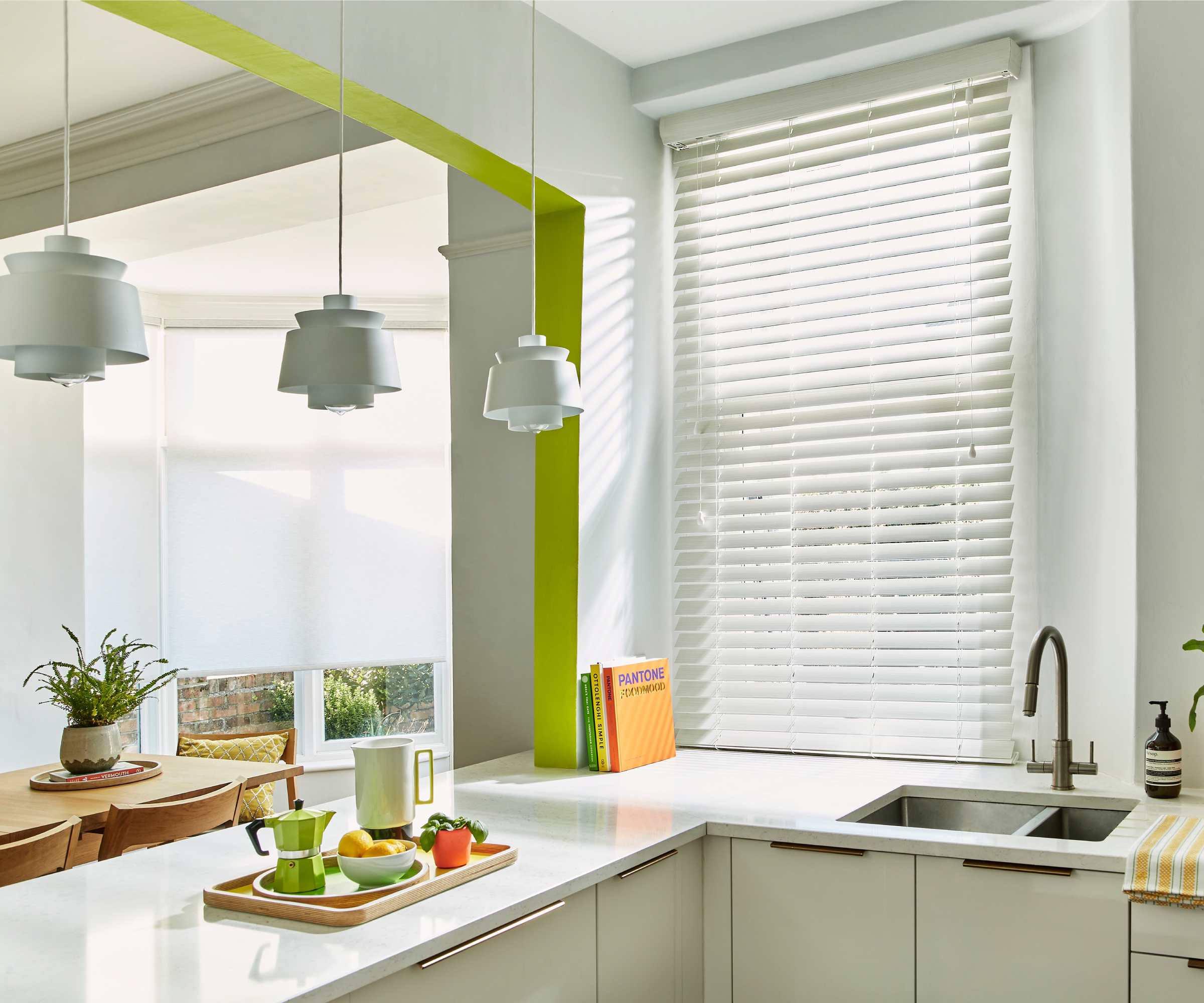 small kitchen with opening knocked through to dining area