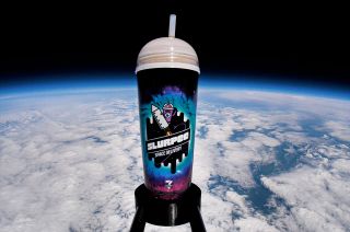 A 7-Eleven Coca-Cola Slurpee is seen flying high above Earth on a balloon-launched "space delivery" for the convenience store's 94th birthday on Tuesday, Aug. 10, 2021.