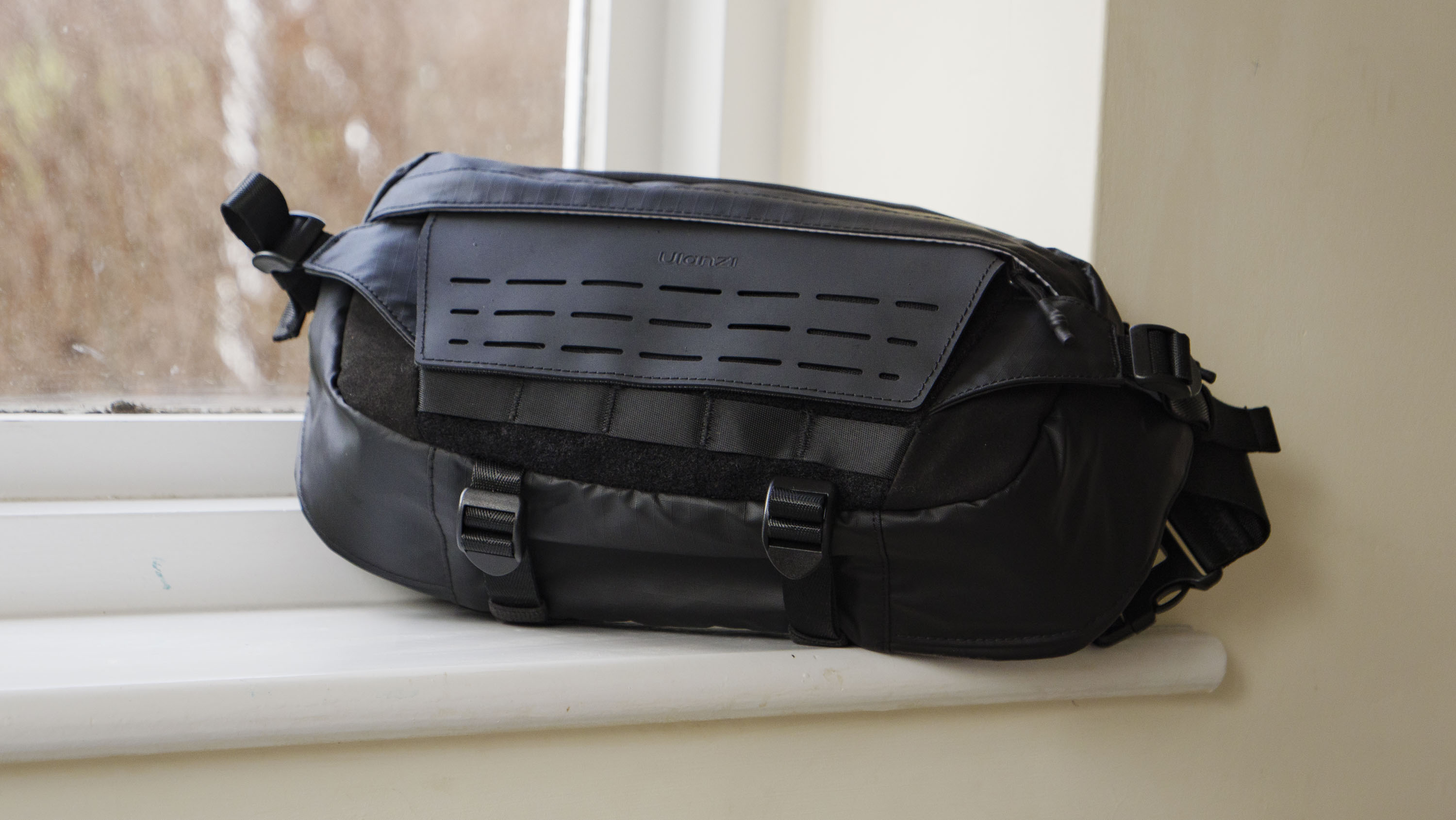 Ulanzi Camera Sling Bag on a window ledge