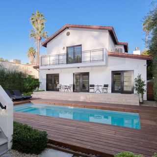 house with pool and pool side chair