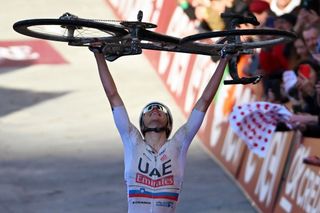 SIENA ITALY MARCH 02 EDITORS NOTE Alternate crop Tadej Pogacar of Slovenia and UAE Team Emirates celebrates at finish line as race winner during the 18th Strade Bianche 2024 Mens Elite a 215km one day race from Siena to Siena 320m UCIWT on March 02 2024 in Siena Italy Photo by Tim de WaeleGetty Images