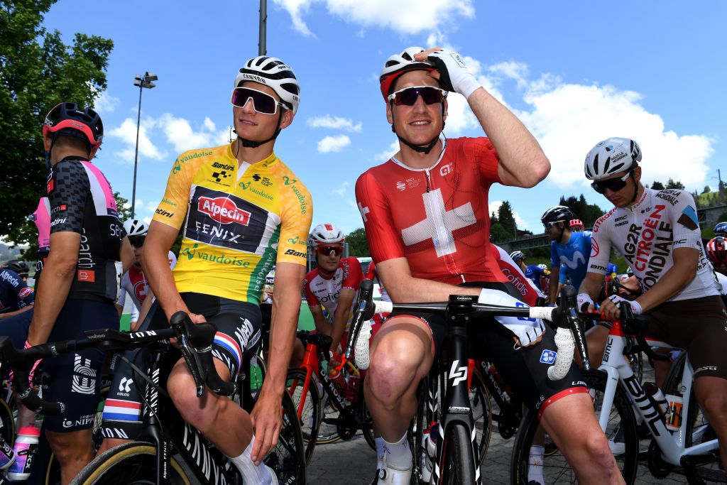 LEUKERBAD SWITZERLAND JUNE 10 Mathieu Van Der Poel of Netherlands and Team AlpecinFenix yellow leader jersey Stefan Kng of Switzerland and Team Groupama FDJ at start during the 84th Tour de Suisse 2021 Stage 5 a 1752km stage from Gstaad to Leukerbad 1385m UCIworldtour tds tourdesuisse on June 10 2021 in Leukerbad Switzerland Photo by Tim de WaeleGetty Images