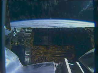 This view of Japan's HTV-4 robotic cargo ship shows the spacecraft as it appears through a camera on the International Space Station's robotic arm on Aug. 9, 2013 during rendezvous and docking operations.